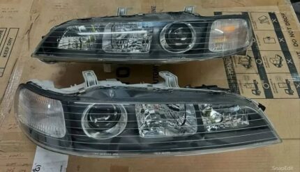 OEM JDM black housing DC2 Type-r headlights.